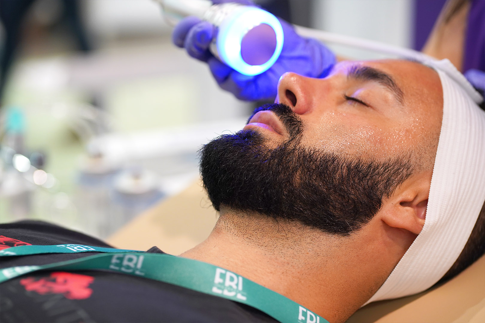 Men's facial demo of spa equipment